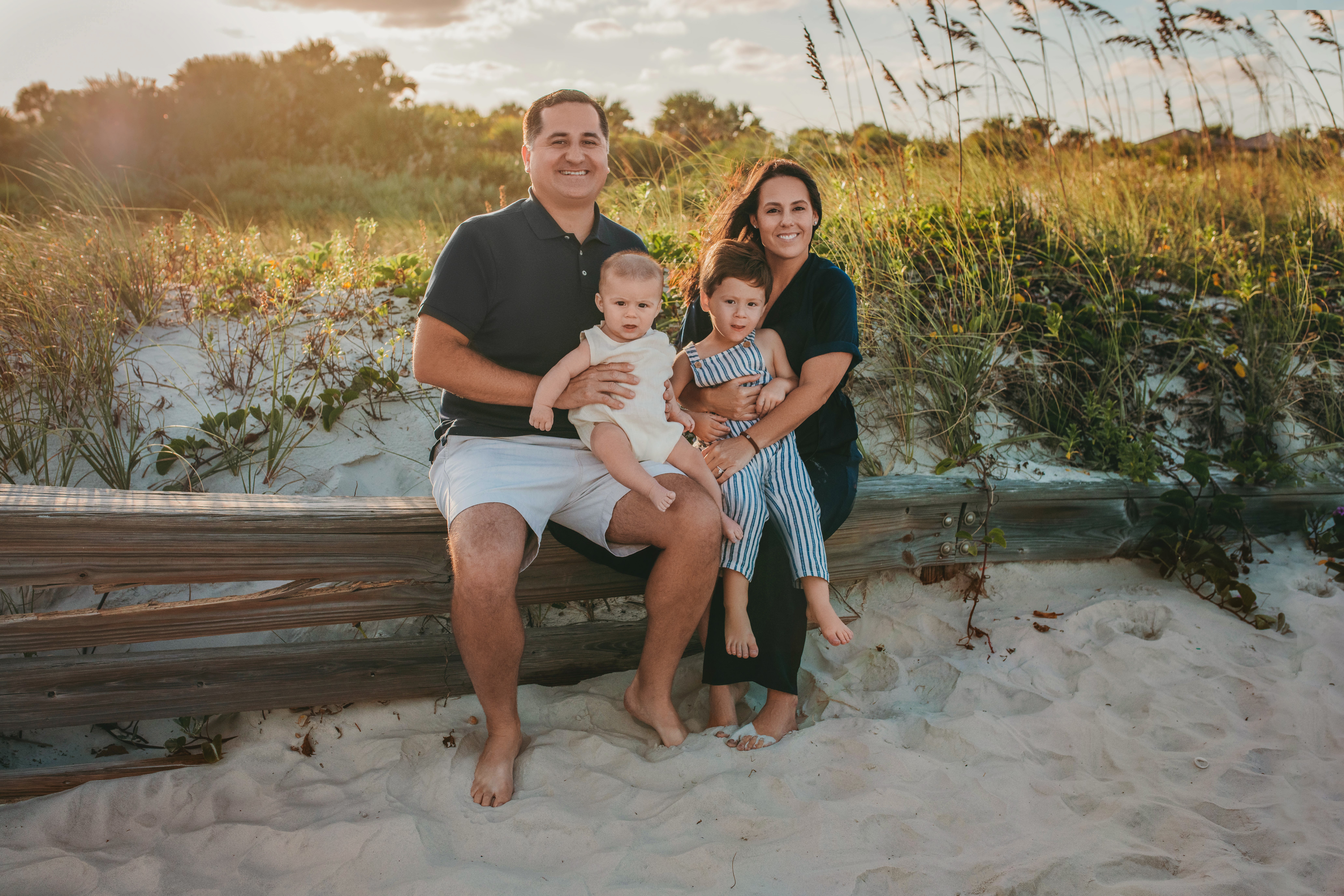 Attorney Justin Saar and his wife, Sara, enjoy a trip to Cocoa Beach, Fla., with their two sons, Preston, 2, and Henry, 4.