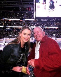 Heather Stover and her father, Art Stover, at a Tampa Bay Lightning game.