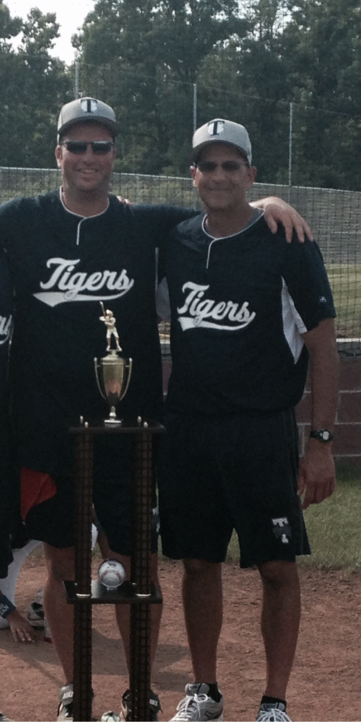 Tom Barni with his close friend "Coach," with whom he coached his son's travel baseball team for many years. They also have a professional relationship: Barni executed the sale of his friend’s business to a private equity firm.