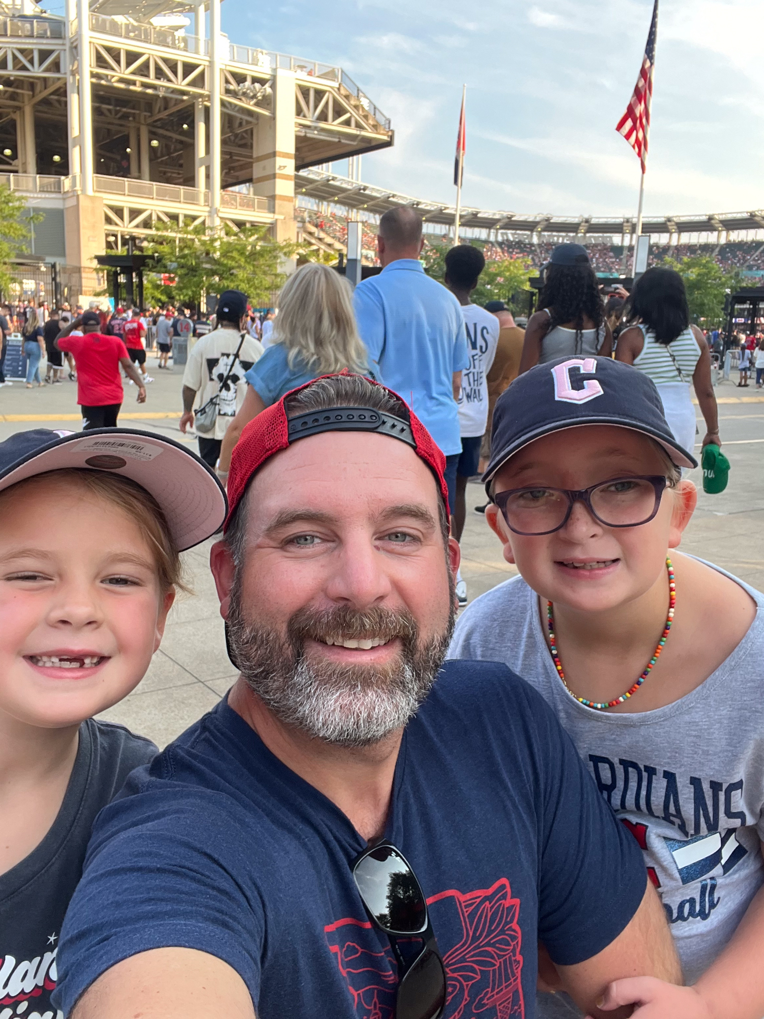 Bob Terbrack and his two daughters, Tess and Colette, attend a Cleveland Guardians game at Progressive Field.