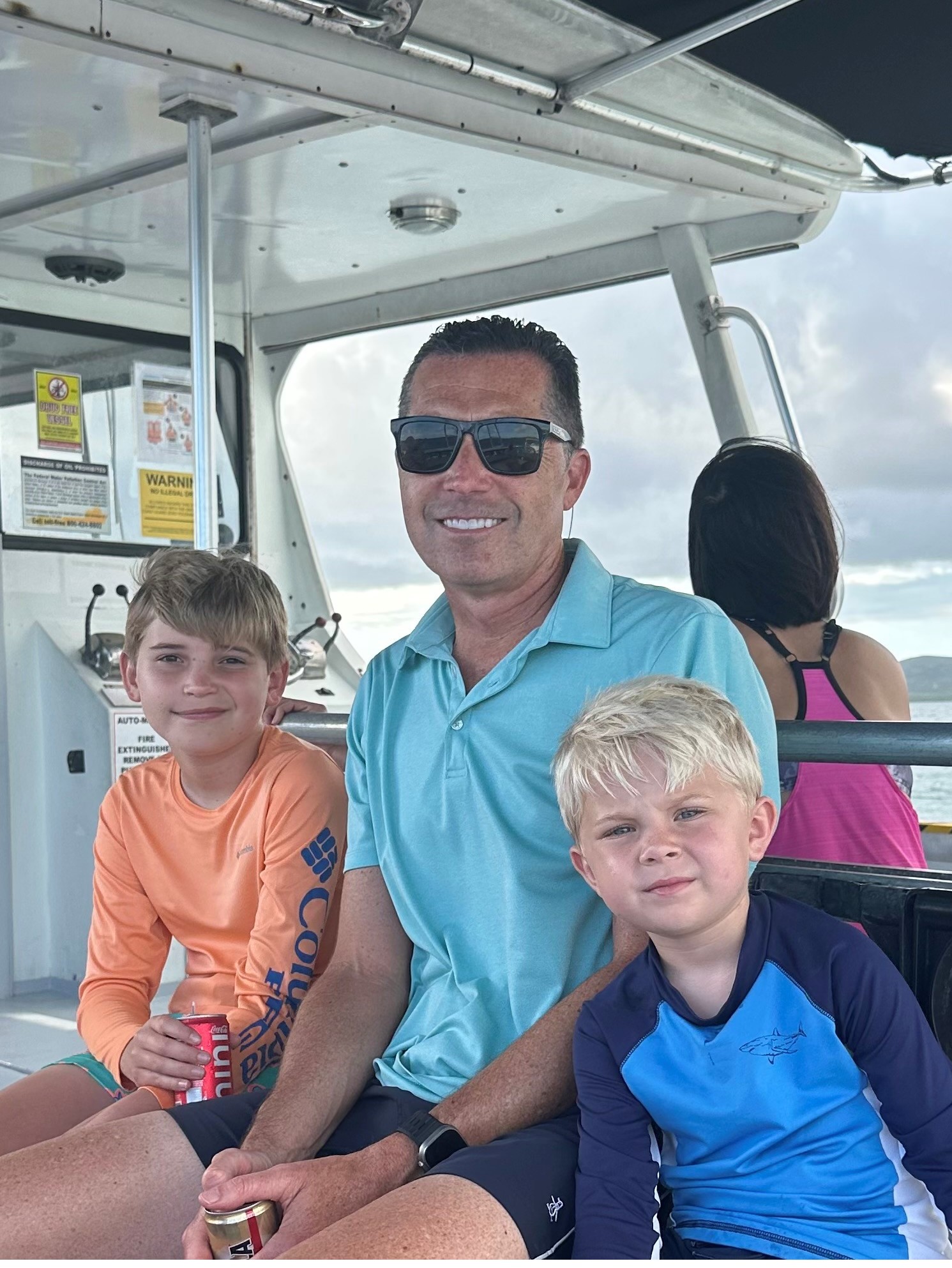 Tim with his two sons, Benjamin, 11, and Pierce, 6, who are into swimming, track, and basketball.