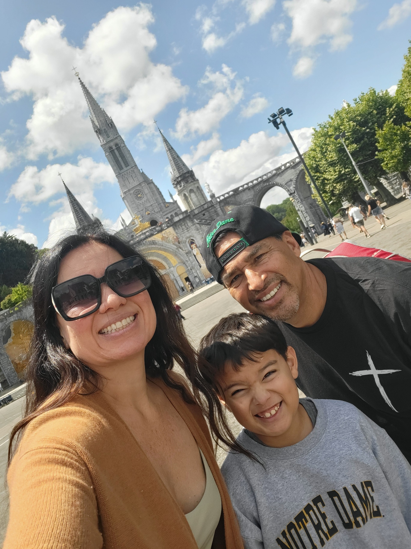 To celebrate earning a Doctorate in Theology from Notre Dame, Michael Pérez traveled to Lourdes, France, in July 2025 with his wife, Beckie, and son, Ezekiel.