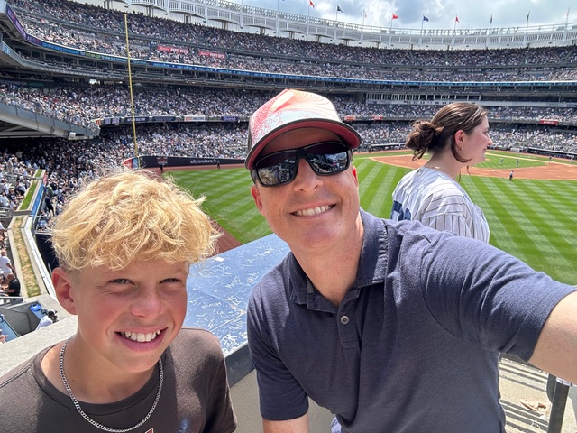 Travis and his son, Jesse, catch an A's game at Oakland Coliseum.