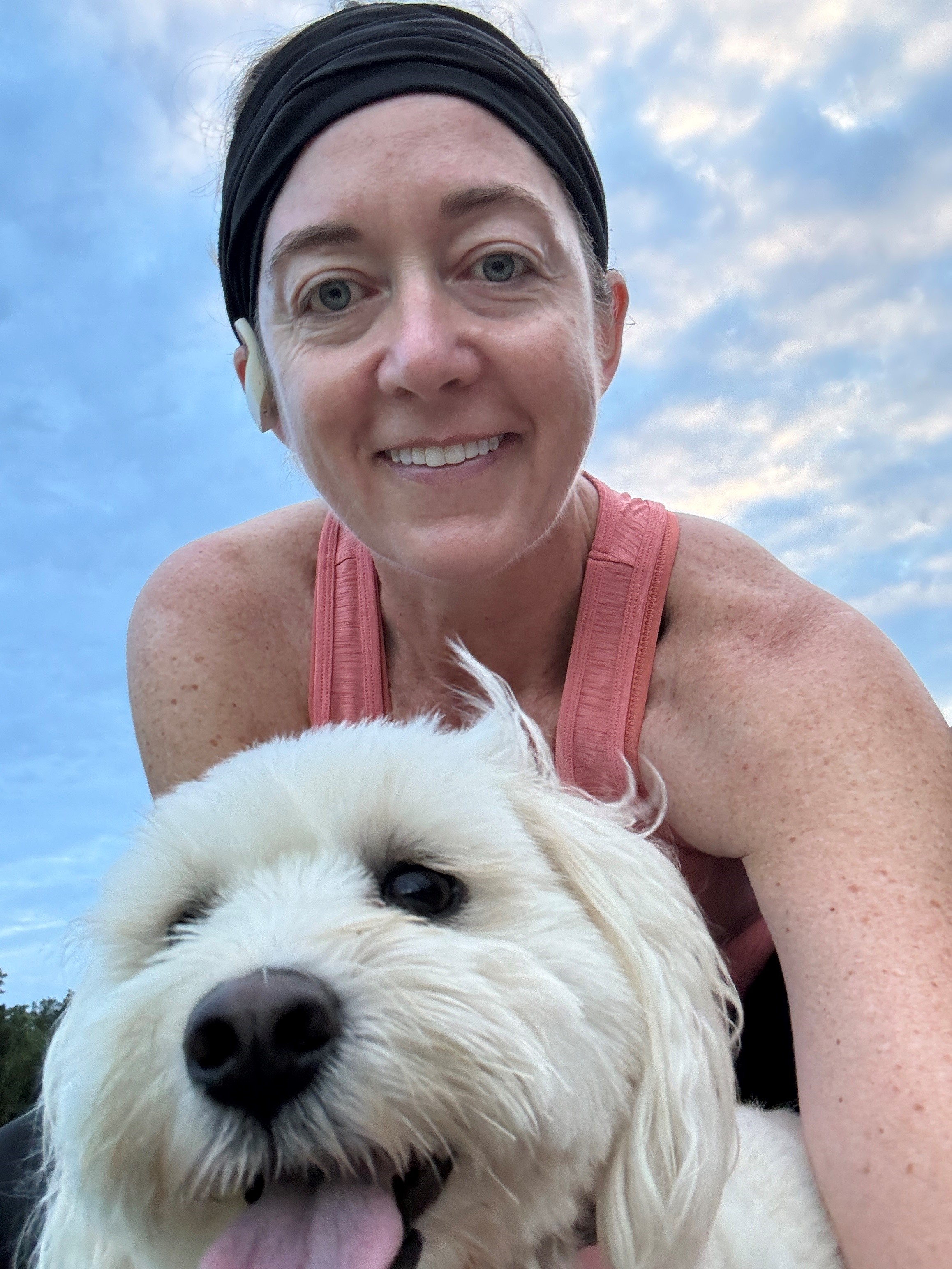 Kelly runs 40 miles a week and enjoys running with Belle, one of her three rescue dogs.
