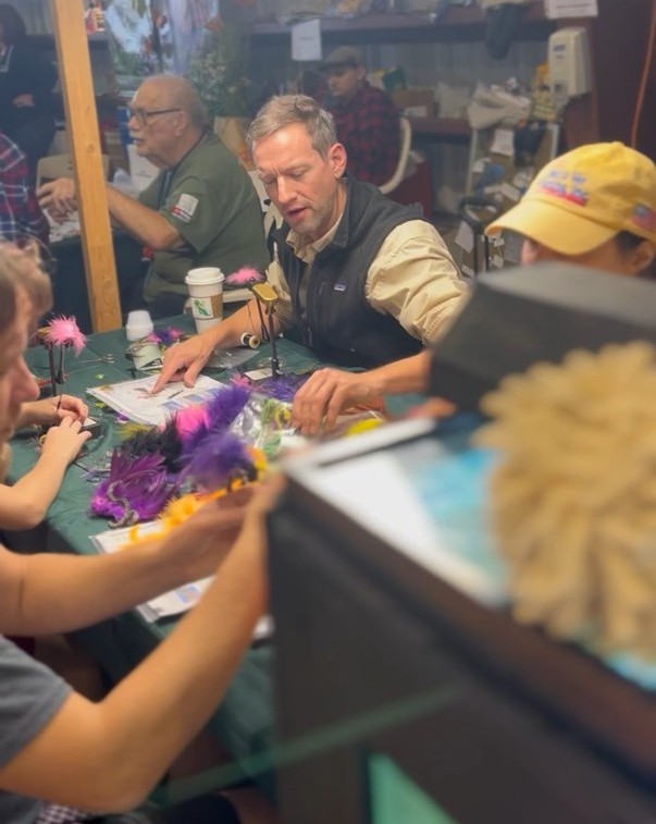 Adam works the Trout Unlimited booth at the Durham Fair in Connecticut. He has been active with conservation group for years.
