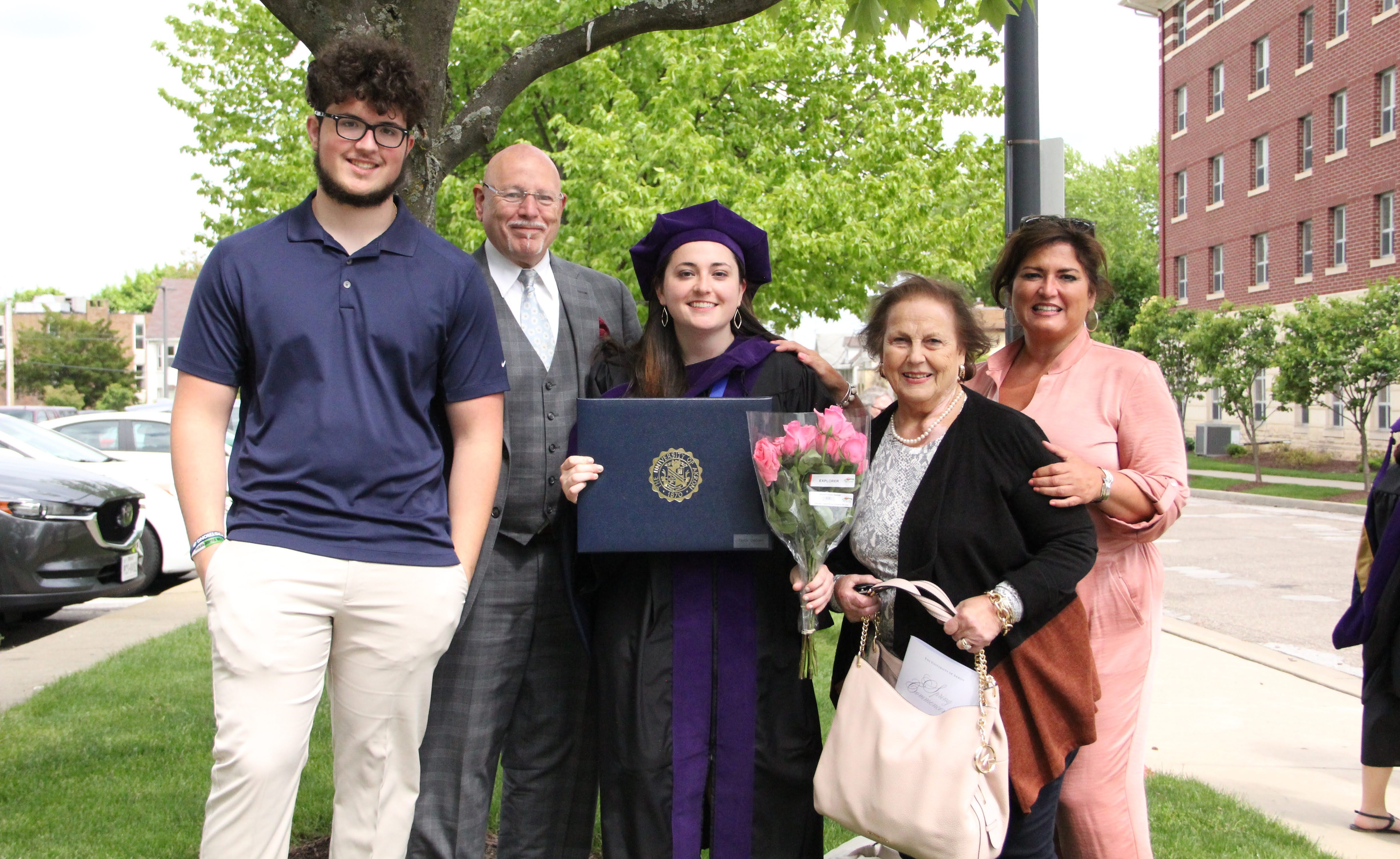 Taylor is a graduate of the University of Akron School of Law. She was surrounded by family at graduation, including (l-r) her brother, Vincent, her uncle, Fred, her nana, and her mother, Janet.