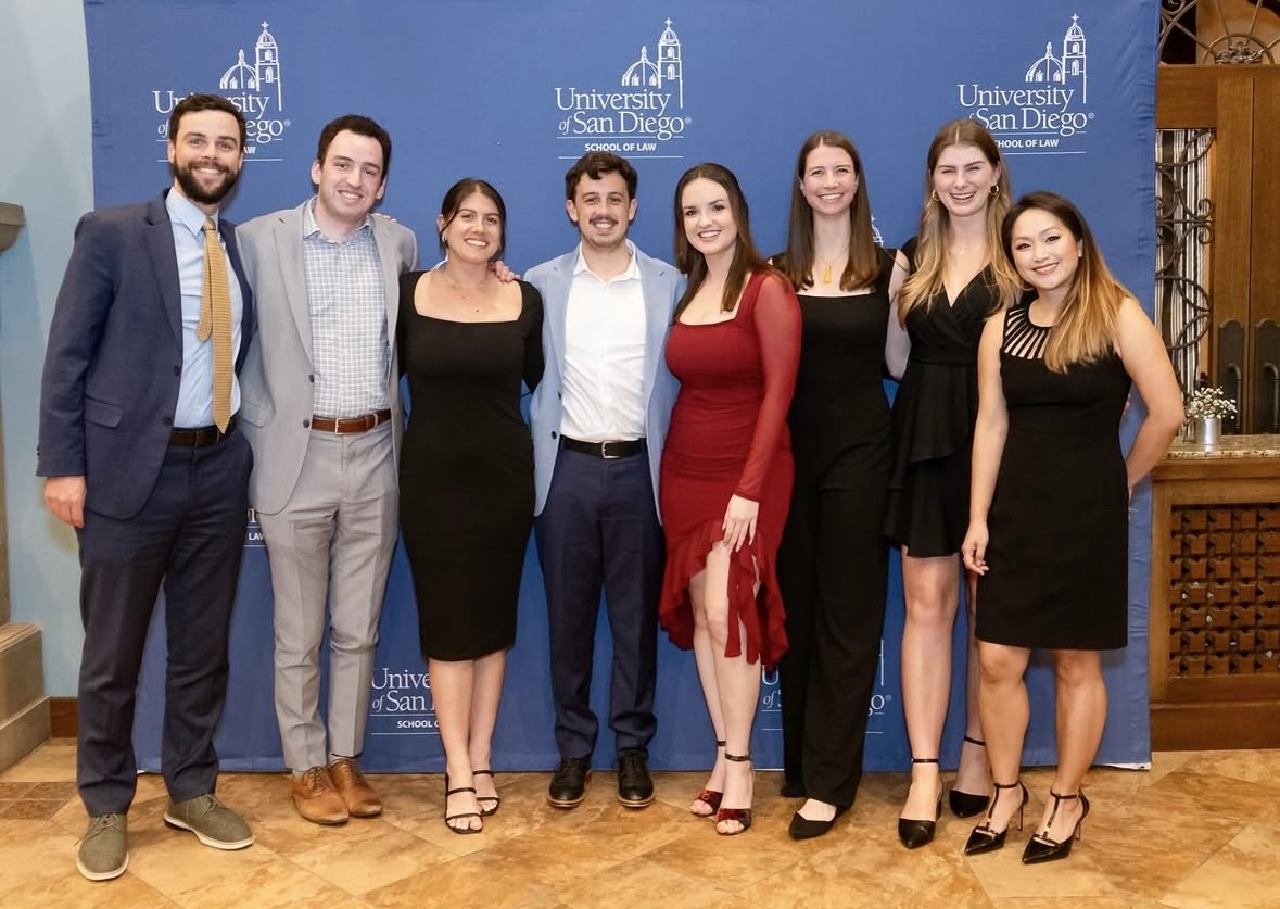Frances (second from right), who serves as an arbitrator for the University of San Diego’s Vis International Commercial Arbitration Moot Team (VICAM), gathers with fellow VICAM alumni at the team's annual fundraising gala.