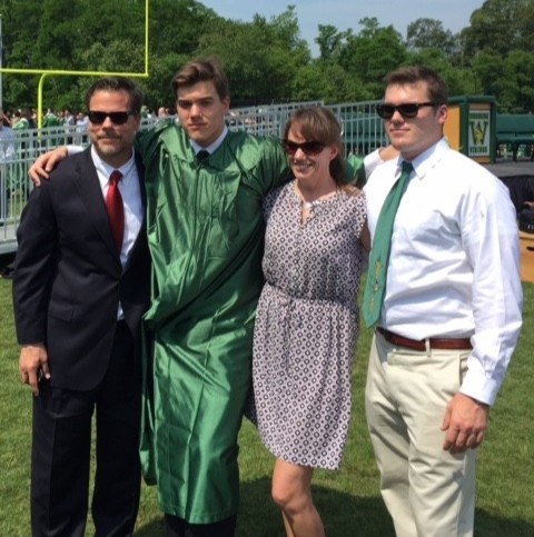 Geoff’s family, including his parents, Ed and Laura, and his brother, Brad, celebrate his graduation from high school in Woodbridge, Va.